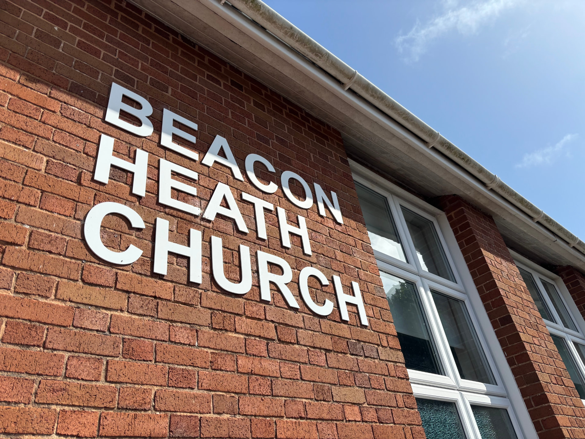 Beacon Heath Church sign on the brick exterior of the church building
